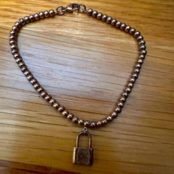 Tiffany & Co. Jewelry - Tiffany & Co. small bead bracelet with lock pendant silver